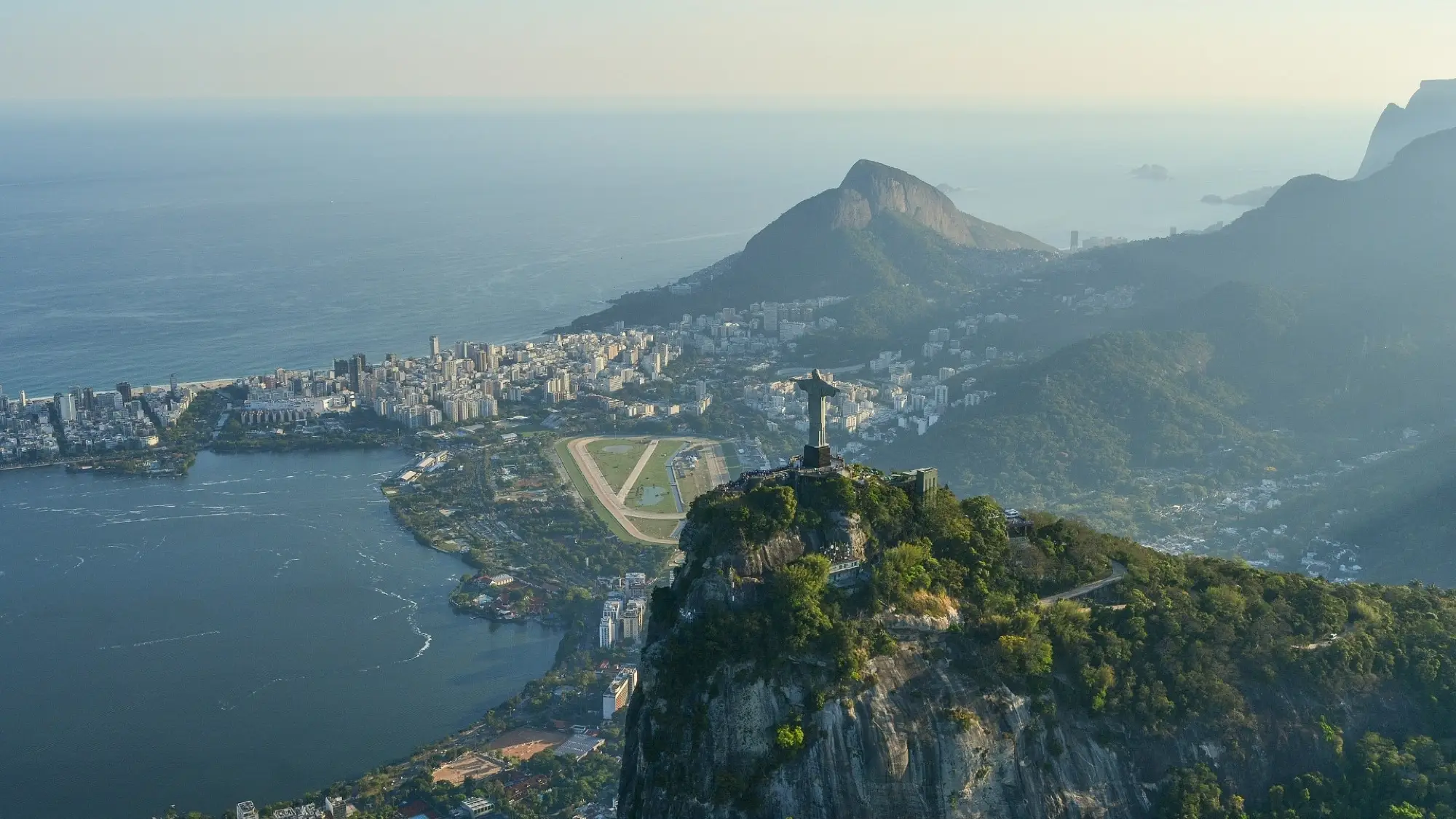 Christ the Redeemer on Corcovado seen from the air, with the Lagoa, the Jockey Club racecourse and Two Brothers Hill behind